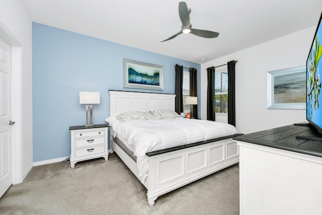 2209 Crofton Ave, Davenport, FL 33837 - bedroom with light colored carpet, baseboards, and a ceiling fan