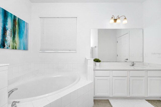 2209 Crofton Ave, Davenport, FL 33837 - full bathroom featuring vanity, a garden tub, and tile patterned flooring