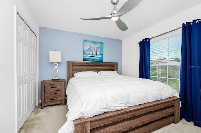 2209 Crofton Ave, Davenport, FL 33837 - bedroom featuring light colored carpet, a closet, and ceiling fan