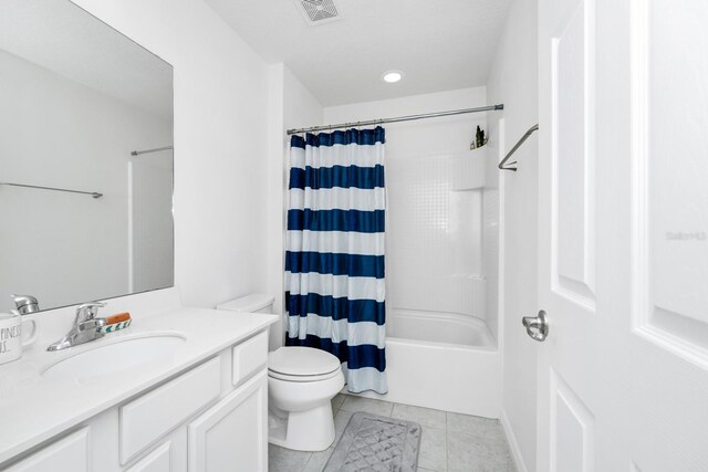 2209 Crofton Ave, Davenport, FL 33837 - full bath featuring vanity, toilet, tile patterned flooring, and shower / bath combination with curtain