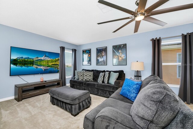 2209 Crofton Ave, Davenport, FL 33837 - living area with carpet, a ceiling fan, and baseboards