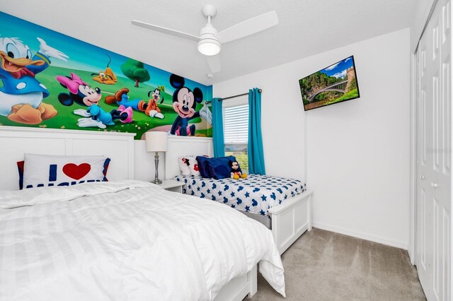2209 Crofton Ave, Davenport, FL 33837 - bedroom with a closet, light colored carpet, a ceiling fan, and baseboards
