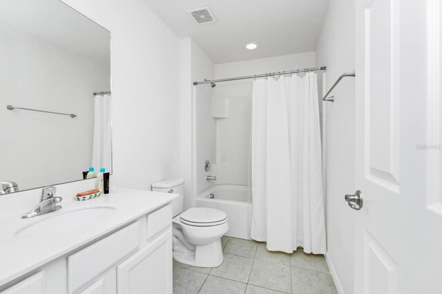 2209 Crofton Ave, Davenport, FL 33837 - full bathroom with vanity, toilet, tile patterned flooring, shower / bath combination with curtain, and recessed lighting