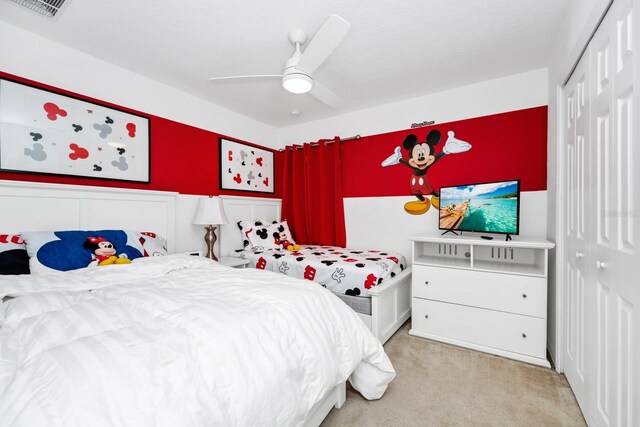 2209 Crofton Ave, Davenport, FL 33837 - bedroom with a closet, light colored carpet, and a ceiling fan