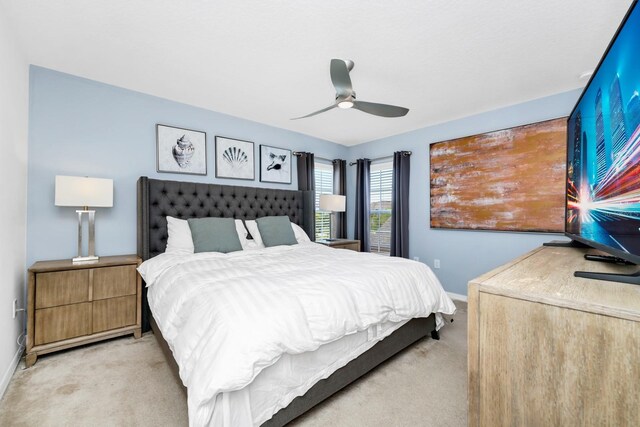 2209 Crofton Ave, Davenport, FL 33837 - bedroom with light carpet, baseboards, and ceiling fan