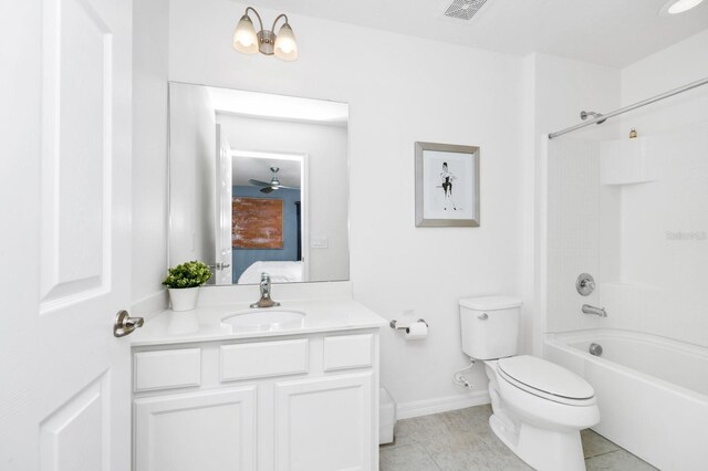 2209 Crofton Ave, Davenport, FL 33837 - full bath featuring vanity, toilet, shower / tub combination, tile patterned flooring, and baseboards
