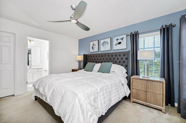 2209 Crofton Ave, Davenport, FL 33837 - bedroom with light carpet, ensuite bathroom, and ceiling fan