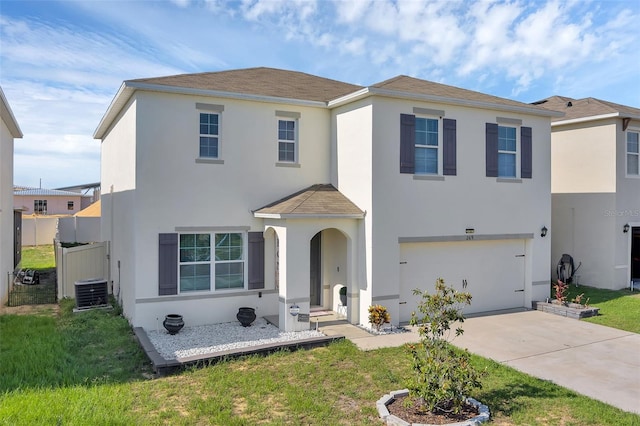 269 Ludisia Loop, Davenport, FL 33837 - view of front of house featuring stucco siding, an attached garage, concrete driveway, cooling unit, and roof with shingles
