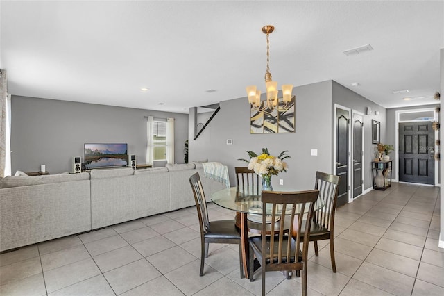 269 Ludisia Loop, Davenport, FL 33837 - dining space featuring a chandelier and light tile patterned floors
