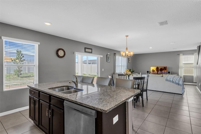 269 Ludisia Loop, Davenport, FL 33837 - kitchen featuring dishwasher, a sink, a chandelier, open floor plan, and plenty of natural light