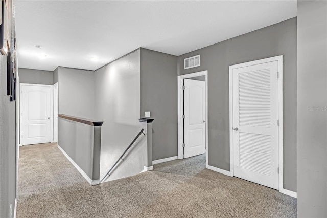 269 Ludisia Loop, Davenport, FL 33837 - hall featuring an upstairs landing, carpet flooring, and baseboards