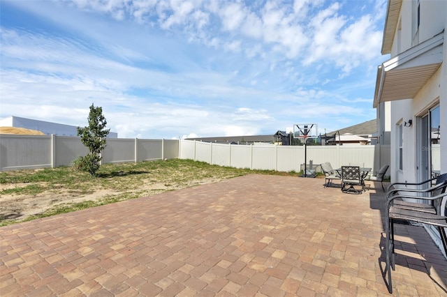 269 Ludisia Loop, Davenport, FL 33837 - fenced backyard featuring a patio and outdoor dining space