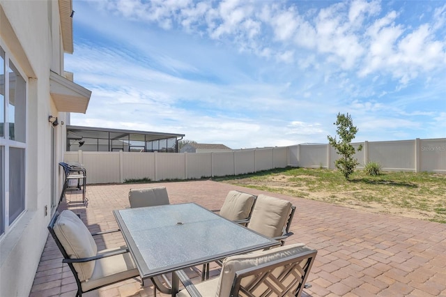 269 Ludisia Loop, Davenport, FL 33837 - fenced backyard with a patio and outdoor dining area