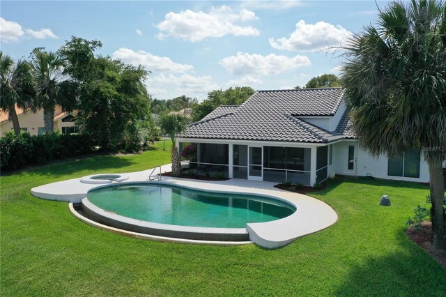 12508 Lake Denise Blvd, Clermont, FL 34711 - view of swimming pool featuring a sunroom, a yard, and a pool with connected hot tub