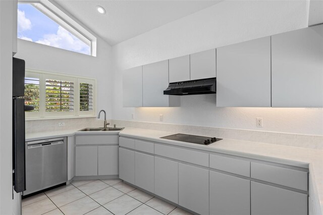 12508 Lake Denise Blvd, Clermont, FL 34711 - kitchen featuring stainless steel dishwasher, under cabinet range hood, black electric stovetop, a sink, and light countertops