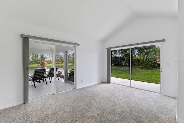 12508 Lake Denise Blvd, Clermont, FL 34711 - unfurnished room featuring healthy amount of natural light, vaulted ceiling, carpet flooring, and baseboards