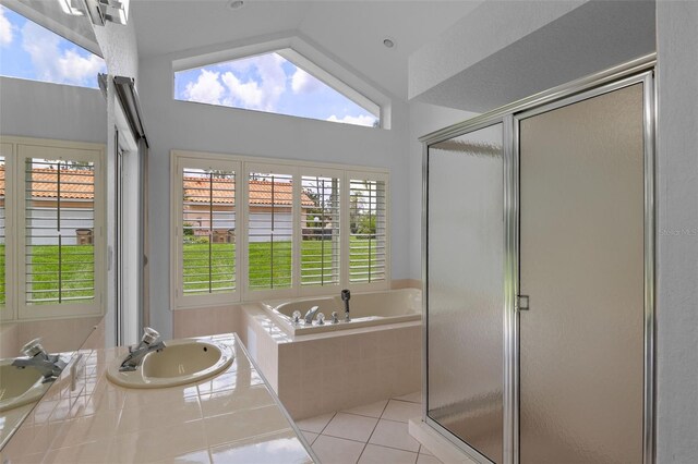 12508 Lake Denise Blvd, Clermont, FL 34711 - full bath with a sink, a garden tub, tile patterned floors, a shower stall, and lofted ceiling