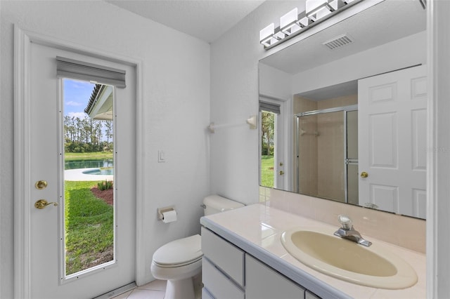 12508 Lake Denise Blvd, Clermont, FL 34711 - bathroom with vanity, a shower stall, toilet, and tile patterned floors