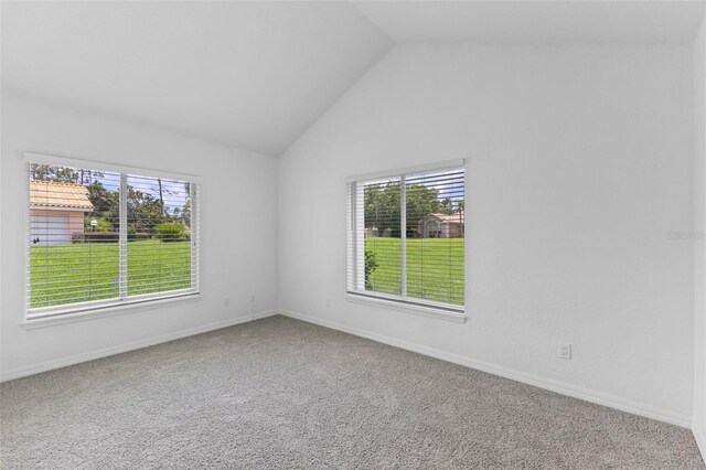 12508 Lake Denise Blvd, Clermont, FL 34711 - spare room with healthy amount of natural light, lofted ceiling, carpet floors, and baseboards