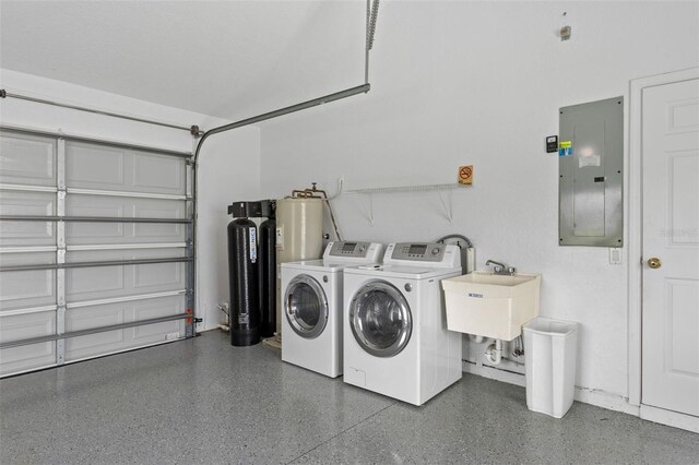 12508 Lake Denise Blvd, Clermont, FL 34711 - washroom with electric panel, washing machine and clothes dryer, and water heater