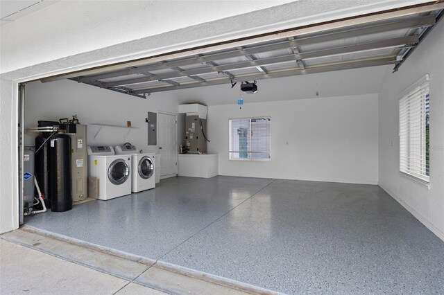 12508 Lake Denise Blvd, Clermont, FL 34711 - garage featuring separate washer and dryer, electric panel, a garage door opener, and heating unit