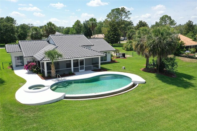 12508 Lake Denise Blvd, Clermont, FL 34711 - swimming pool with a yard, a sunroom, and a patio