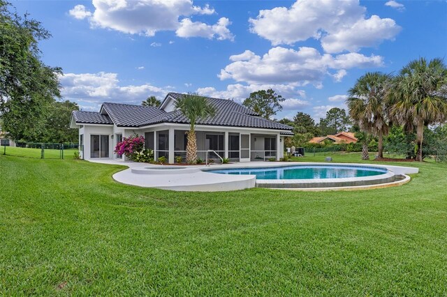 12508 Lake Denise Blvd, Clermont, FL 34711 - rear view of property featuring a sunroom, stucco siding, and a tiled roof