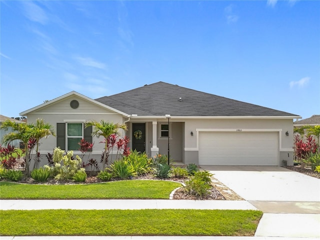 15865 Bradicks Ct, Clermont, FL 34711 - single story home featuring a garage, stucco siding, a front yard, and concrete driveway