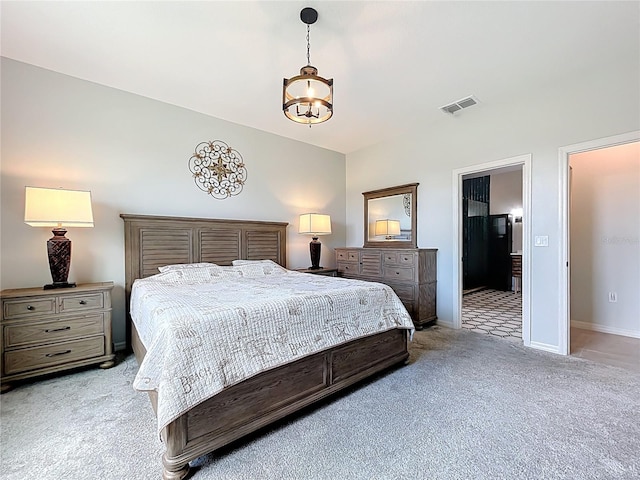 15865 Bradicks Ct, Clermont, FL 34711 - bedroom with light colored carpet, a chandelier, baseboards, and connected bathroom