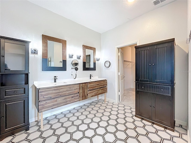 15865 Bradicks Ct, Clermont, FL 34711 - full bath featuring double vanity, tile patterned floors, and baseboards