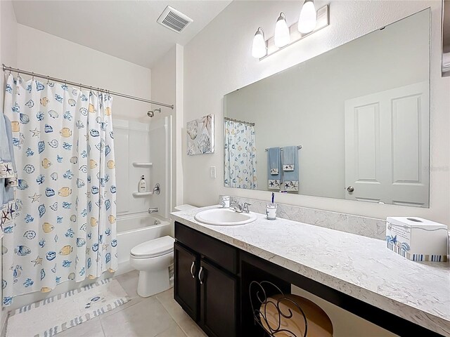 15865 Bradicks Ct, Clermont, FL 34711 - bathroom with tile patterned flooring, vanity, toilet, and shower / bath combo with shower curtain
