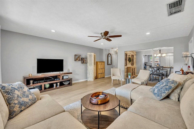 4306 Lake Underhill Rd Unit C, Orlando, FL 32803 - living area with wood finished floors, baseboards, a ceiling fan, a chandelier, and recessed lighting