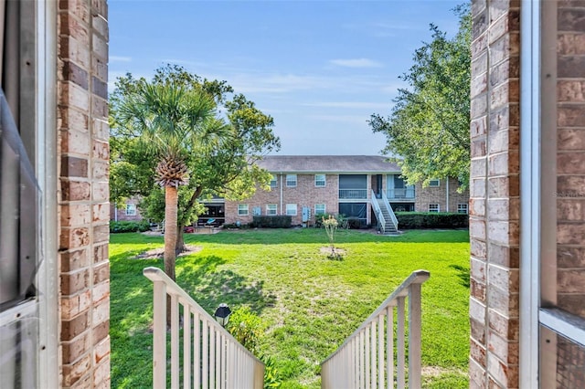 4306 Lake Underhill Rd Unit C, Orlando, FL 32803 - view of green lawn featuring a balcony