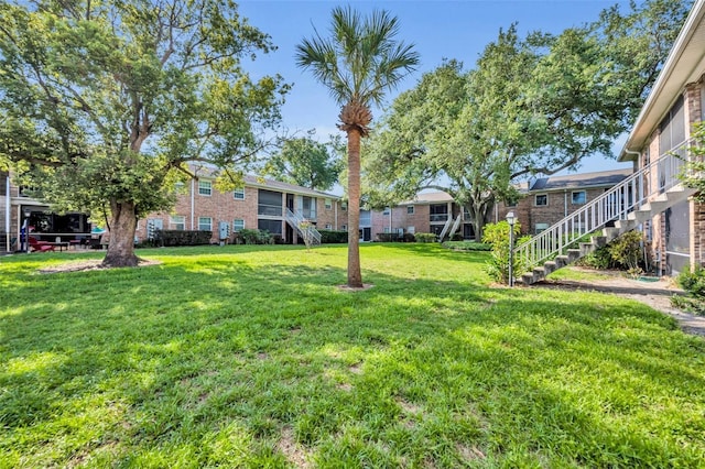 4306 Lake Underhill Rd Unit C, Orlando, FL 32803 - view of grassy yard featuring stairway