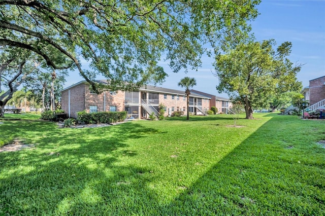4306 Lake Underhill Rd Unit C, Orlando, FL 32803 - view of grassy yard featuring stairs