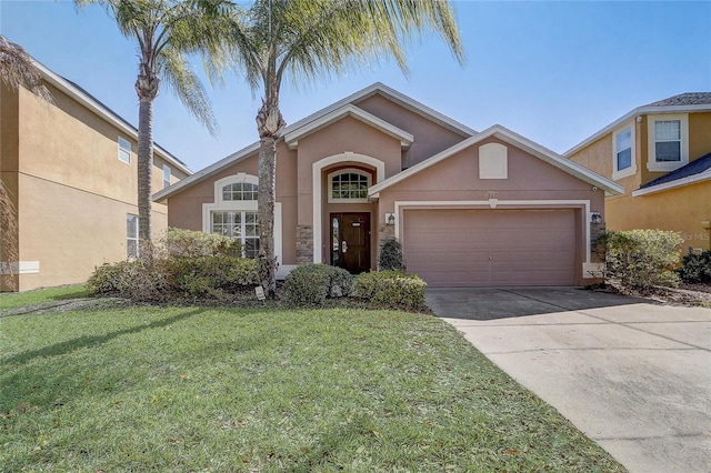 927 Orange Cosmos Blvd, Davenport, FL 33837 - traditional-style home featuring stucco siding, a garage, driveway, a front lawn, and stone siding