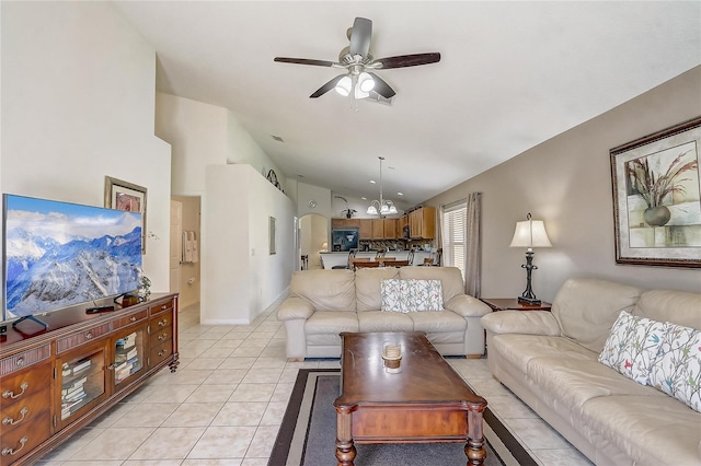 927 Orange Cosmos Blvd, Davenport, FL 33837 - living room with vaulted ceiling, ceiling fan, and light tile patterned flooring
