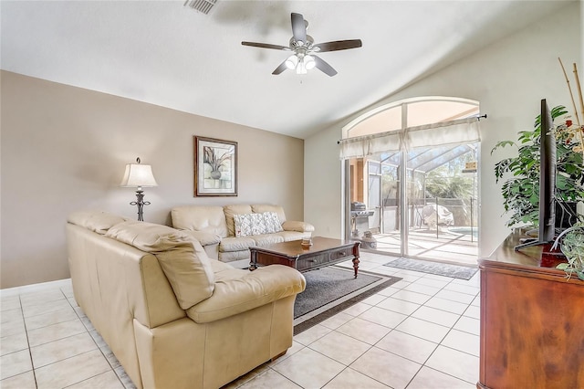 927 Orange Cosmos Blvd, Davenport, FL 33837 - living room with light tile patterned flooring, vaulted ceiling, and ceiling fan