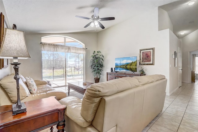 927 Orange Cosmos Blvd, Davenport, FL 33837 - living area featuring ceiling fan, light tile patterned floors, and vaulted ceiling