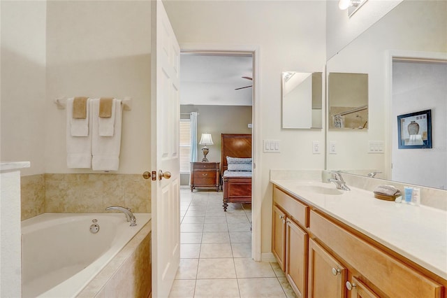 927 Orange Cosmos Blvd, Davenport, FL 33837 - bathroom featuring ensuite bath, a bath, tile patterned floors, vanity, and a ceiling fan