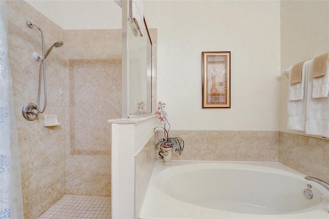 927 Orange Cosmos Blvd, Davenport, FL 33837 - bathroom featuring a garden tub and a tile shower