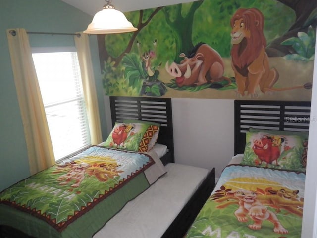 927 Orange Cosmos Blvd, Davenport, FL 33837 - bedroom with multiple windows and lofted ceiling