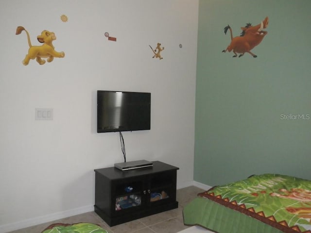 927 Orange Cosmos Blvd, Davenport, FL 33837 - tiled bedroom with baseboards