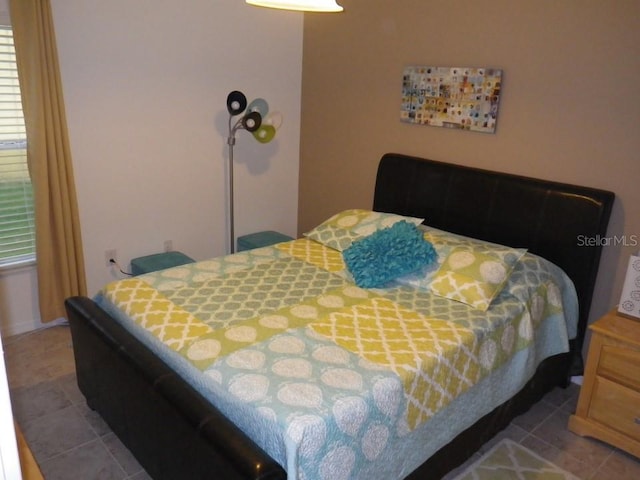927 Orange Cosmos Blvd, Davenport, FL 33837 - bedroom featuring tile patterned floors