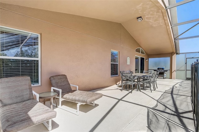 927 Orange Cosmos Blvd, Davenport, FL 33837 - view of patio featuring outdoor dining area and glass enclosure