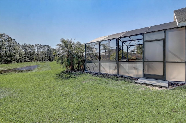 927 Orange Cosmos Blvd, Davenport, FL 33837 - view of grassy yard featuring glass enclosure and a water view