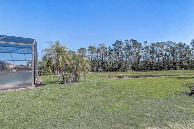 927 Orange Cosmos Blvd, Davenport, FL 33837 - view of grassy yard featuring a lanai and a water view