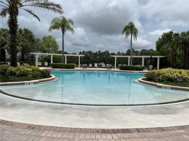 927 Orange Cosmos Blvd, Davenport, FL 33837 - community pool with a pergola