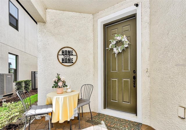 1147 Wildmeadow Run, Winter Park, FL 32792 - property entrance with stucco siding and cooling unit