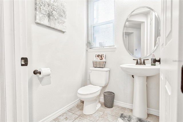 1147 Wildmeadow Run, Winter Park, FL 32792 - half bath with toilet, baseboards, tile patterned floors, and a sink